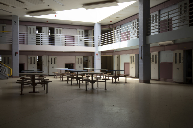 Abandoned jail common room in cell block