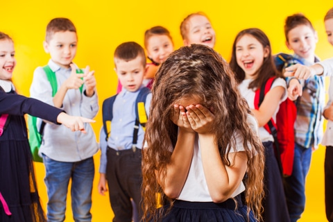 bullying victim surrounded by bullies